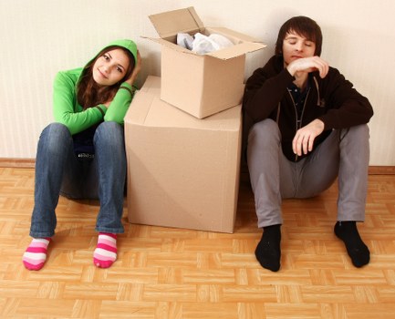Packing and lifting furniture during a removals job in Plaistow