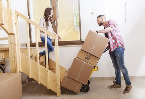 Loading furniture and boxes into a moving truck in Plaistow